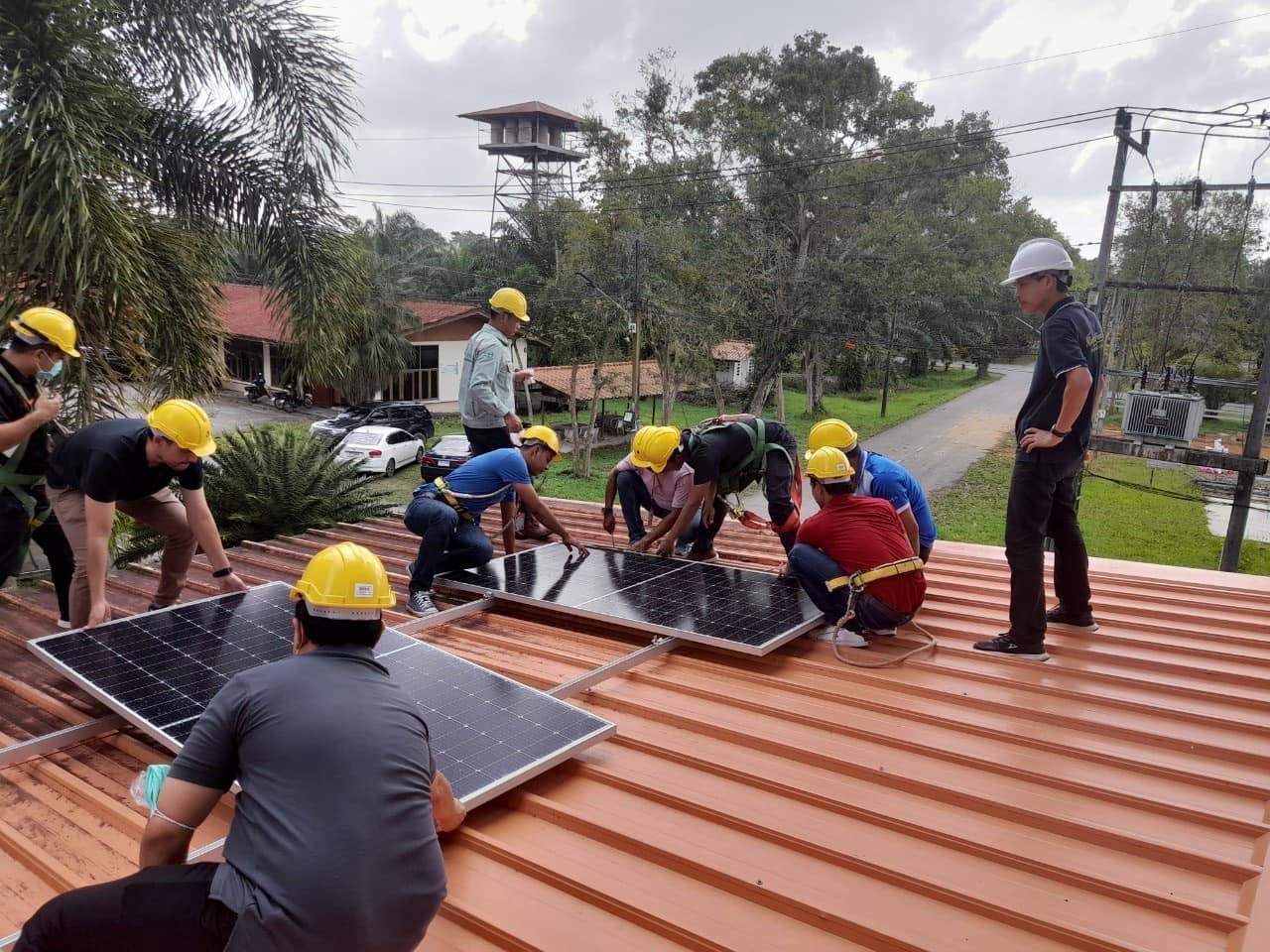 A group of men working on a roof

Description automatically generated