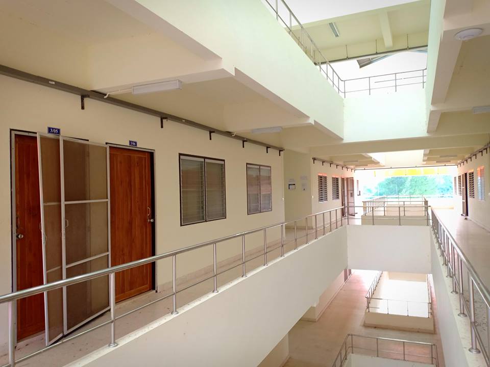 A building with a door and railing

AI-generated content may be incorrect.