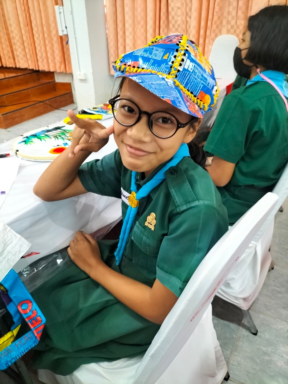 A child wearing a hat and smiling

AI-generated content may be incorrect.