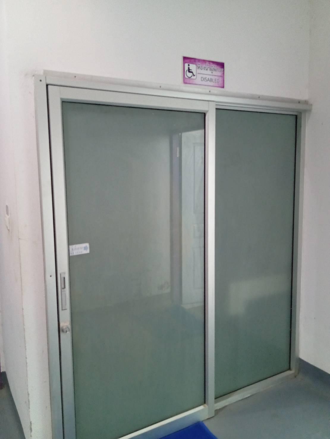 A glass door with a sign
AI-generated content may be incorrect.