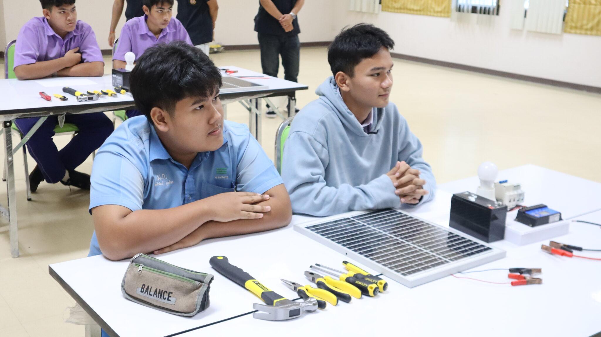 A group of men sitting at a table with tools

AI-generated content may be incorrect.