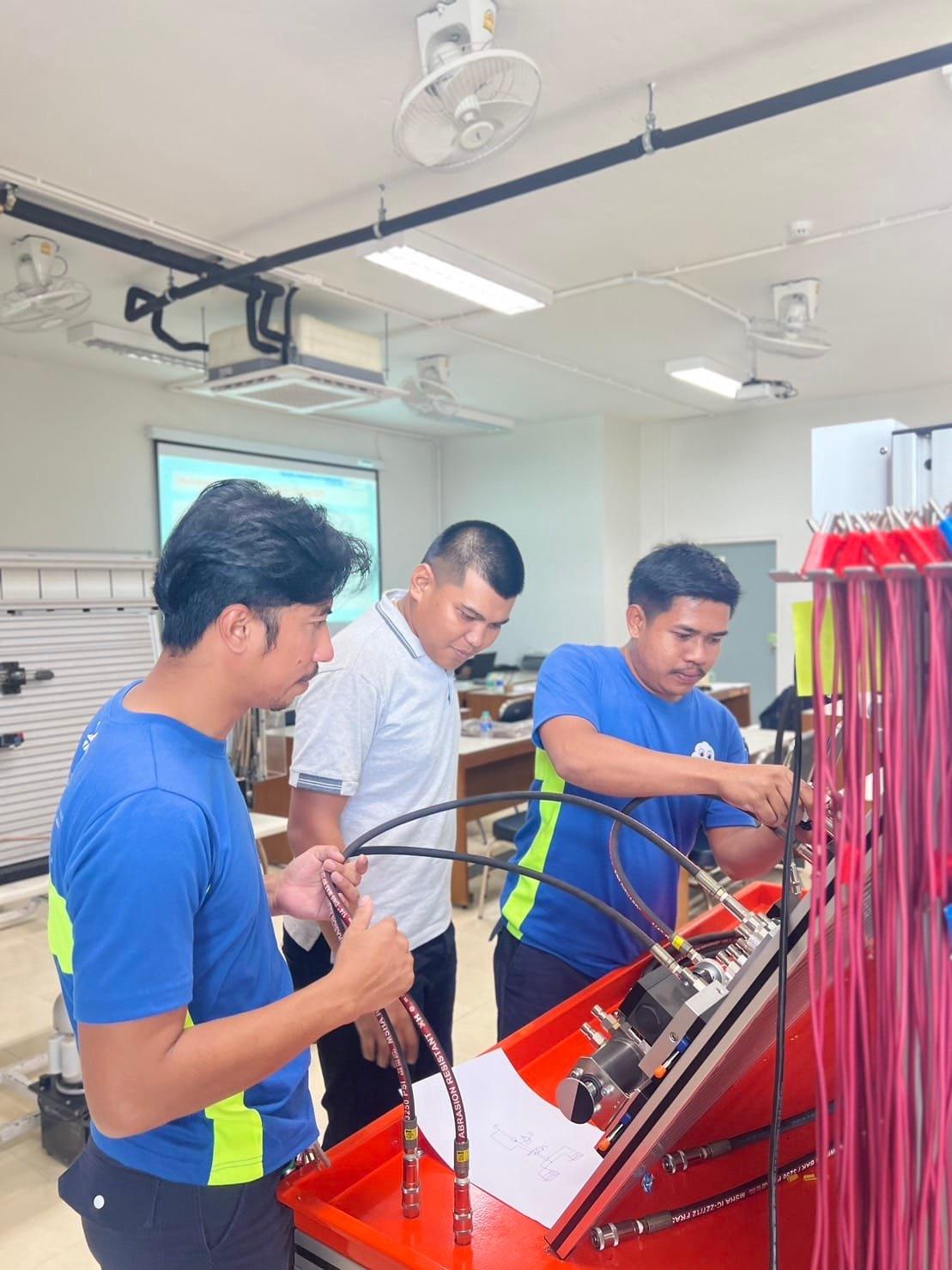 A group of men working on a machine
AI-generated content may be incorrect.