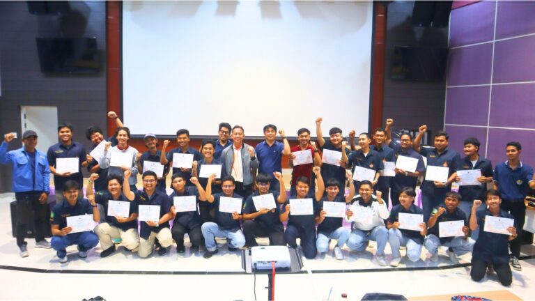 A group of people holding up paper AI-generated content may be incorrect.