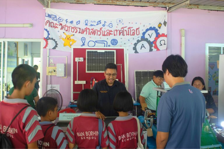 A group of people in a classroom AI-generated content may be incorrect.