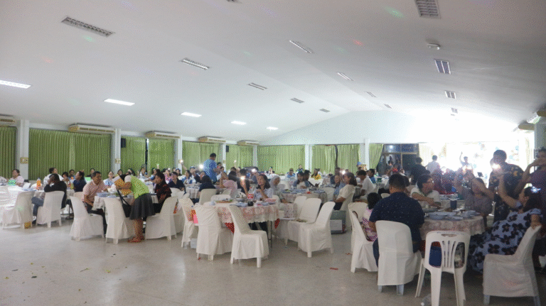 A group of people sitting at tables AI-generated content may be incorrect.