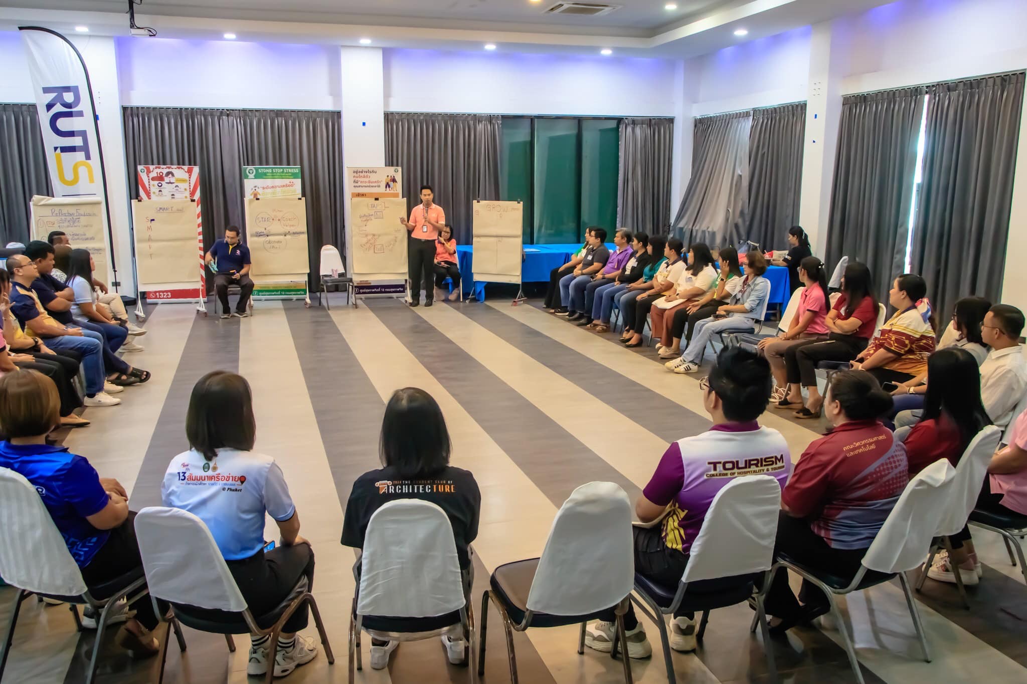 A group of people sitting in chairs in a room
AI-generated content may be incorrect.