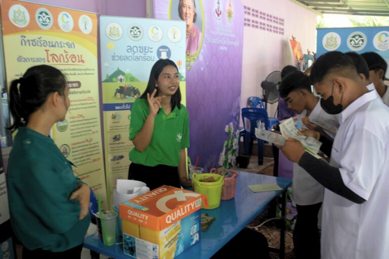 A group of people standing around a table

AI-generated content may be incorrect.