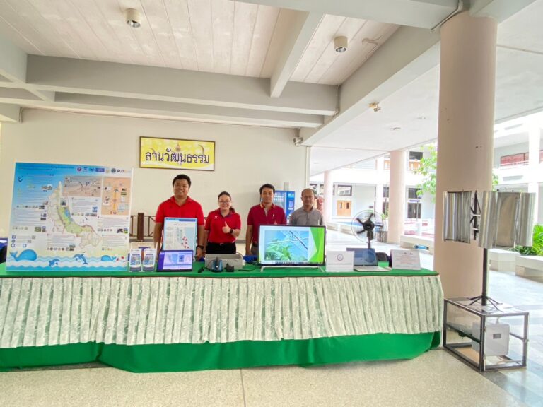 A group of people standing behind a table

AI-generated content may be incorrect.