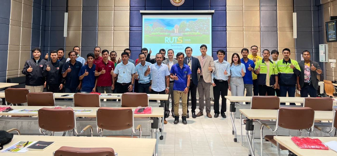 A group of people standing in a room with desks and chairs
AI-generated content may be incorrect.