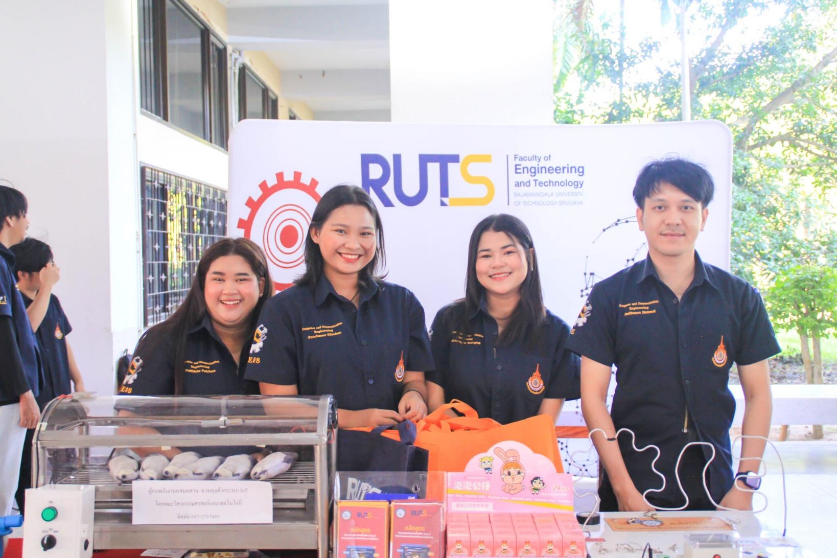 A group of people standing in front of a sign

AI-generated content may be incorrect.
