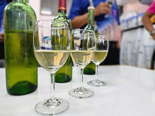 A group of wine glasses and bottles

AI-generated content may be incorrect.