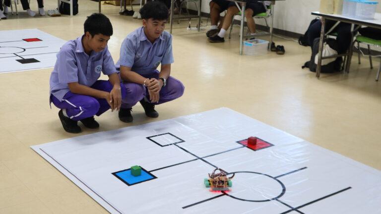 A group of young men looking at a game

AI-generated content may be incorrect.