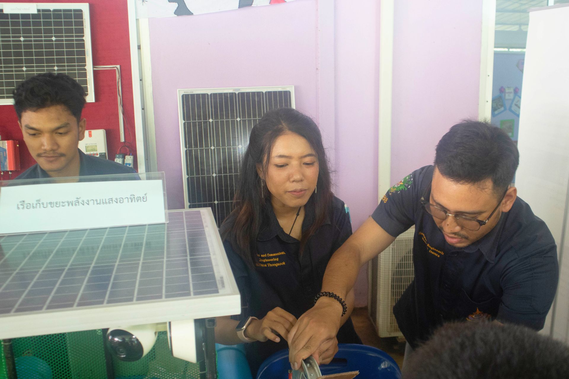 A person and person working on a solar panel

AI-generated content may be incorrect.