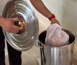 A person putting a lid into a trash can
AI-generated content may be incorrect.