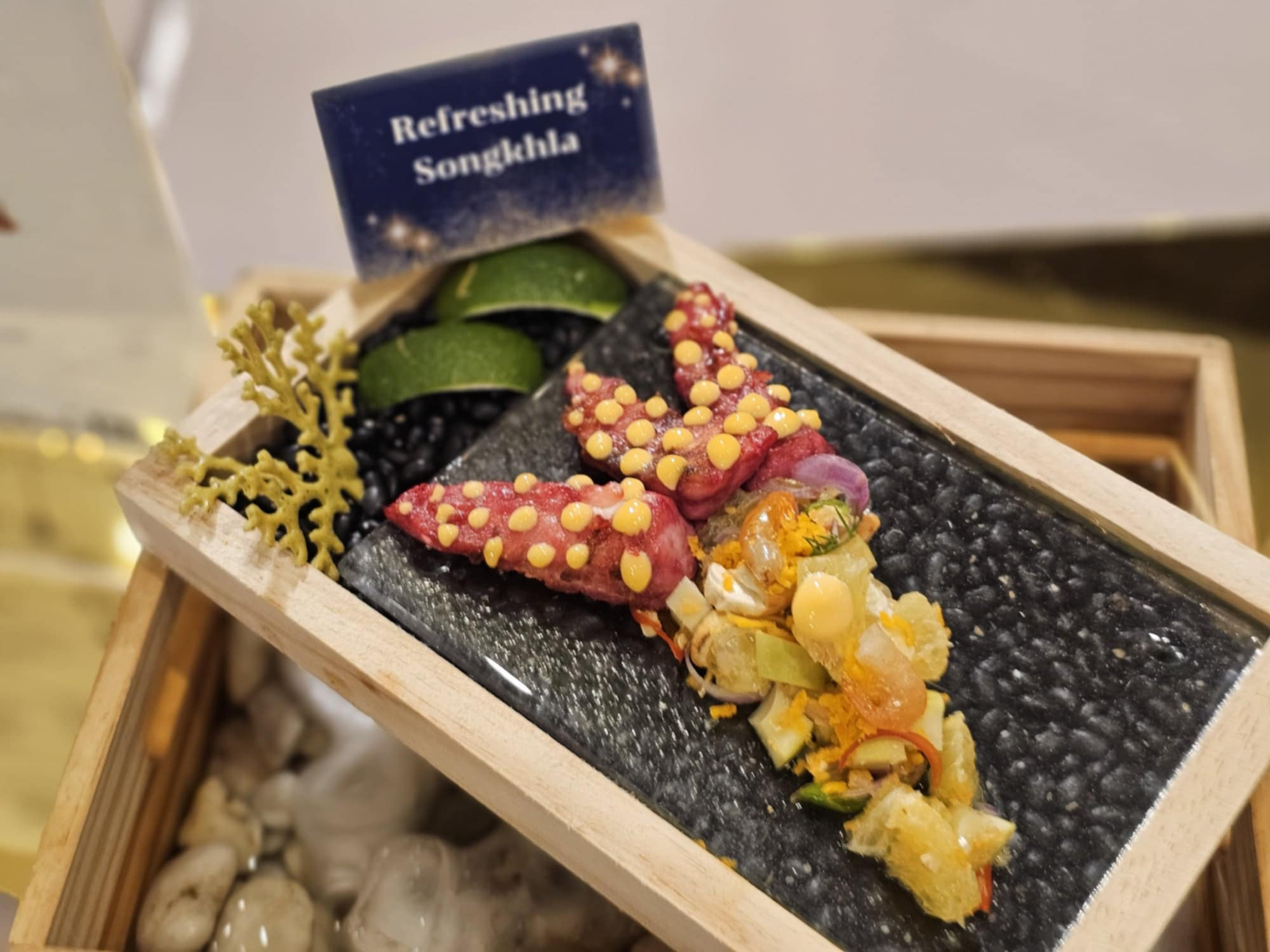 A small wooden box with food on it
AI-generated content may be incorrect.