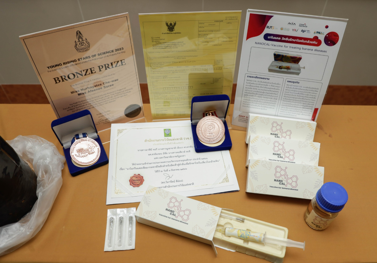 A table with medals and certificates
AI-generated content may be incorrect.