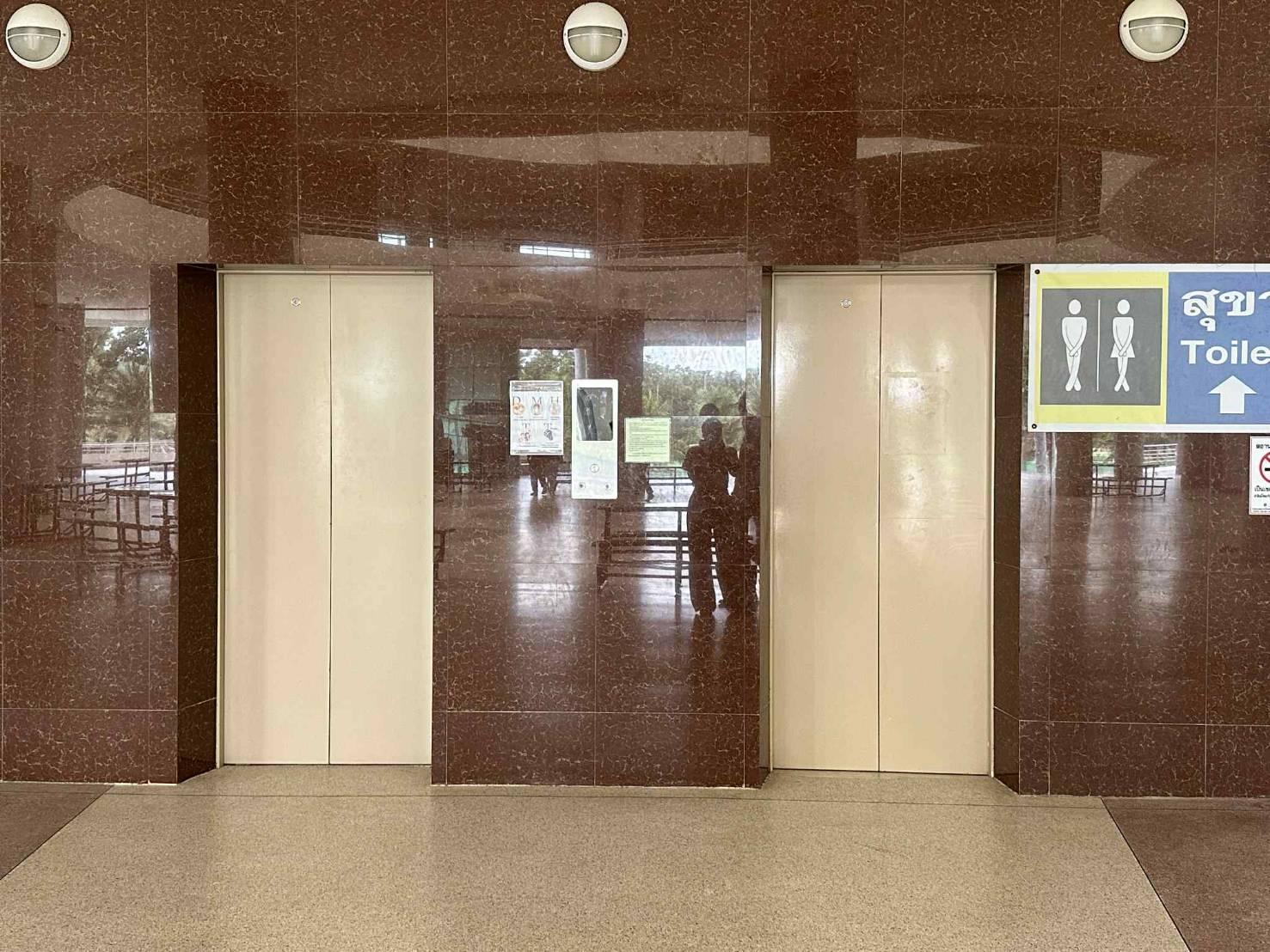 A two elevators in a building
AI-generated content may be incorrect.