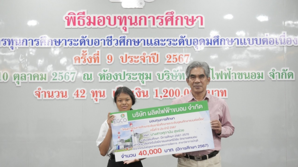 Two people holding a sign
AI-generated content may be incorrect.